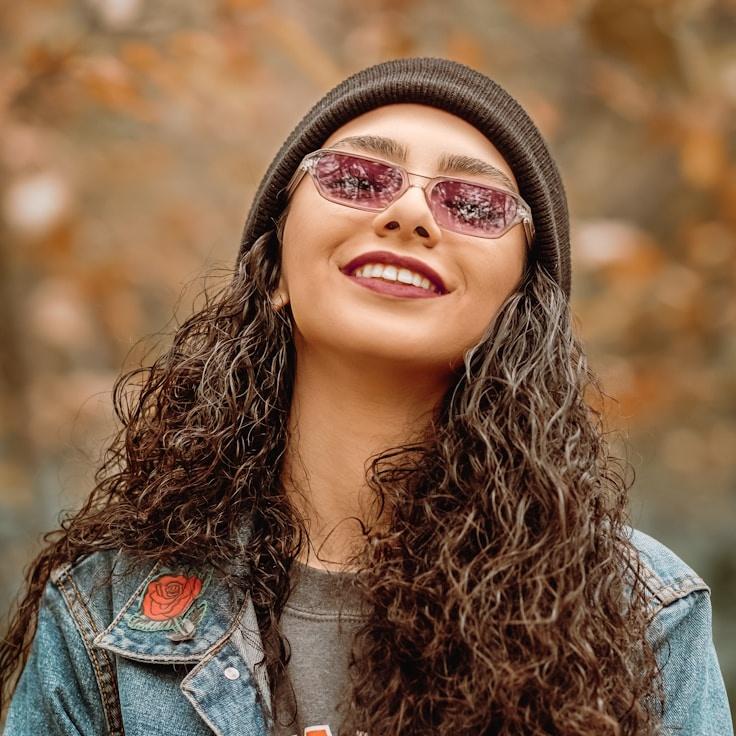 Kaveri Mehta, Lead Design Curator at FieldSparkShop, reviewing corporate floral arrangements